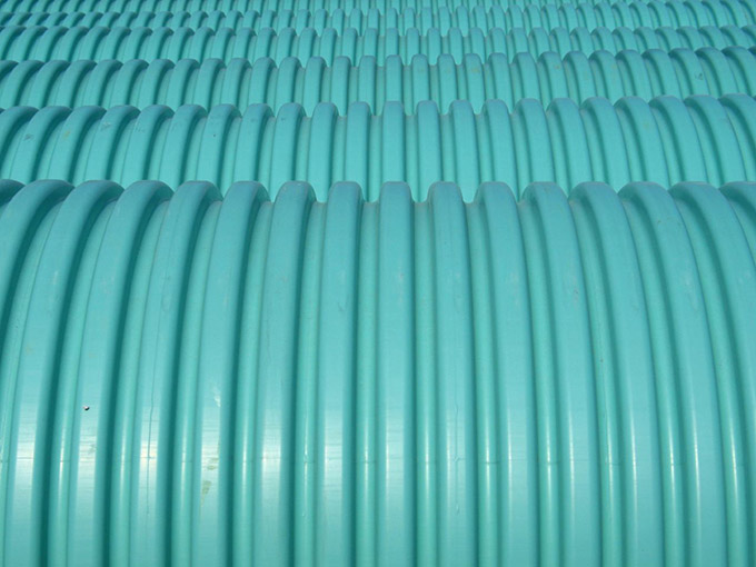 Close up of blue/green plastic barrels